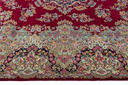 Corner detail of 2000s Kerman rug showing border pattern and Wool pile