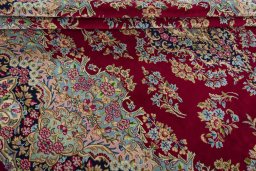 Close-up detail of 2000s Kerman rug from Iran / Persia showing Wool weave