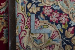 Backside of handmade 2000s Kerman rug showing knot structure and weave density