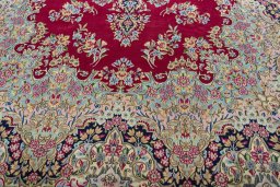 Close-up detail of 2000s Kerman rug from Iran / Persia showing Wool weave