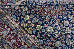 Close-up detail of 2000s Kerman rug from Iran / Persia showing Wool weave