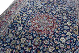 Backside of handmade 2000s Kerman rug showing knot structure and weave density