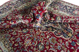 Surface texture of 2000s Kerman rug with natural Wool and intricate pattern