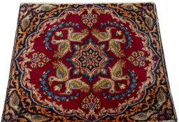 Surface texture of 2000s Kerman rug with natural Wool and intricate pattern