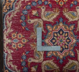 Backside of handmade 2000s Kerman rug showing knot structure and weave density