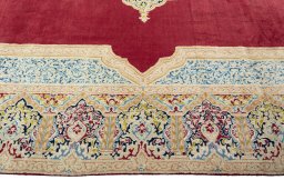 Corner detail of 2000s Kerman rug showing border pattern and Wool pile