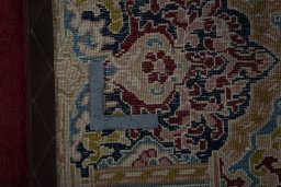Backside of handmade 2000s Kerman rug showing knot structure and weave density