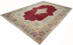 Corner detail of 2000s Kerman rug showing border pattern and Wool pile
