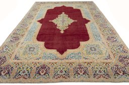 Surface texture of 2000s Kerman rug with natural Wool and intricate pattern