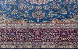 Corner detail of New Kerman rug showing border pattern and Wool pile