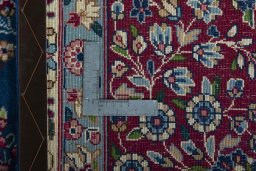 Backside of handmade New Kerman rug showing knot structure and weave density