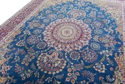 Backside of handmade New Kerman rug showing knot structure and weave density