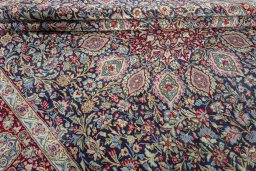 Close-up detail of 2000s Kerman rug from Iran / Persia showing Wool weave