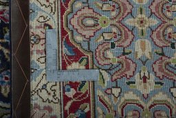 Backside of handmade 2000s Kerman rug showing knot structure and weave density