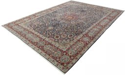 Corner detail of 2000s Kerman rug showing border pattern and Wool pile