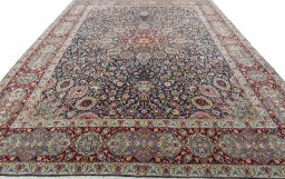 Surface texture of 2000s Kerman rug with natural Wool and intricate pattern