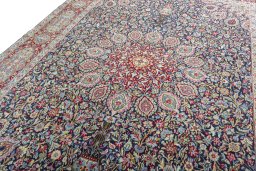 Backside of handmade 2000s Kerman rug showing knot structure and weave density