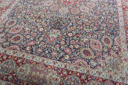 Close-up detail of 2000s Kerman rug from Iran / Persia showing Wool weave
