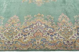 Corner detail of 2000s Kerman rug showing border pattern and Wool pile
