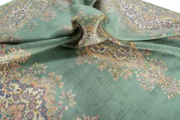 Surface texture of 2000s Kerman rug with natural Wool and intricate pattern