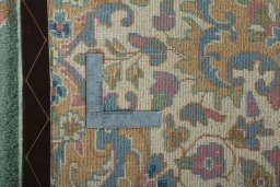 Backside of handmade 2000s Kerman rug showing knot structure and weave density