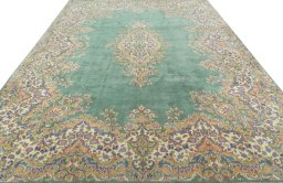 Surface texture of 2000s Kerman rug with natural Wool and intricate pattern