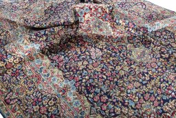 Surface texture of 1970s Kerman rug with natural Wool and intricate pattern