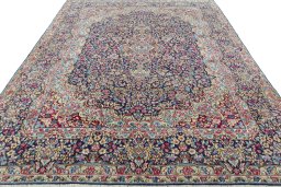 Surface texture of 1970s Kerman rug with natural Wool and intricate pattern