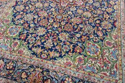 Close-up detail of 2000s Kerman rug from Iran / Persia showing Wool weave