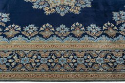 Corner detail of 2000s Kerman rug showing border pattern and Wool pile