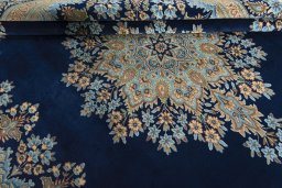 Close-up detail of 2000s Kerman rug from Iran / Persia showing Wool weave