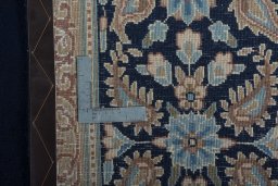 Backside of handmade 2000s Kerman rug showing knot structure and weave density