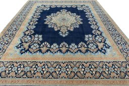 Surface texture of 2000s Kerman rug with natural Wool and intricate pattern
