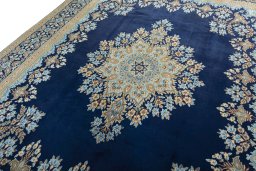Backside of handmade 2000s Kerman rug showing knot structure and weave density