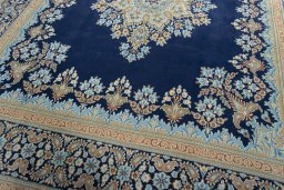 Close-up detail of 2000s Kerman rug from Iran / Persia showing Wool weave