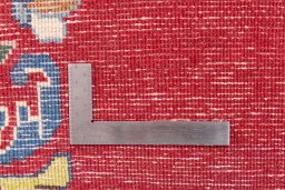 Corner detail of 2002s Kerman rug showing border pattern and Wool pile