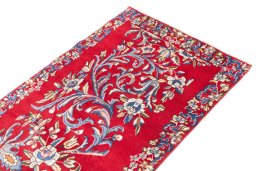 Surface texture of 2002s Kerman rug with natural Wool and intricate pattern