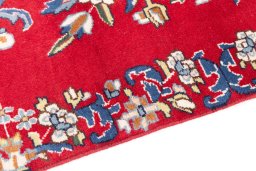 Backside of handmade 2002s Kerman rug showing knot structure and weave density