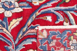 Close-up detail of 2002s Kerman rug from Iran / Persia showing Wool weave