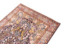 Surface texture of 1980s Kerman rug with natural Wool and intricate pattern