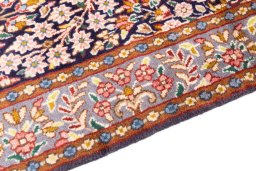 Backside of handmade 1980s Kerman rug showing knot structure and weave density