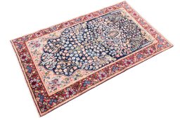 Corner detail of 1970s Kerman rug showing border pattern and Wool pile