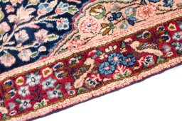Backside of handmade 1970s Kerman rug showing knot structure and weave density