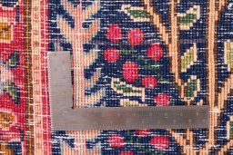 Corner detail of 1970s Kerman rug showing border pattern and Wool pile