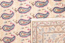 Close-up detail of 1980s Kerman rug from Iran / Persia showing Wool weave