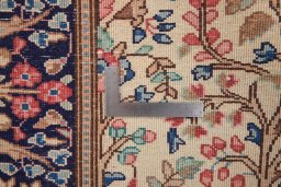 Corner detail of 2000s Kerman rug showing border pattern and Wool pile