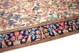 Backside of handmade 2000s Kerman rug showing knot structure and weave density