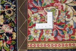 Close-up detail of 1990s Kerman rug from Iran / Persia showing Wool weave