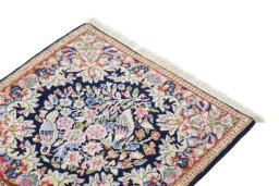 Surface texture of 1990s Kerman rug with natural Wool and intricate pattern