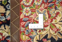 Close-up detail of 1990s Kerman rug from Iran / Persia showing Wool weave